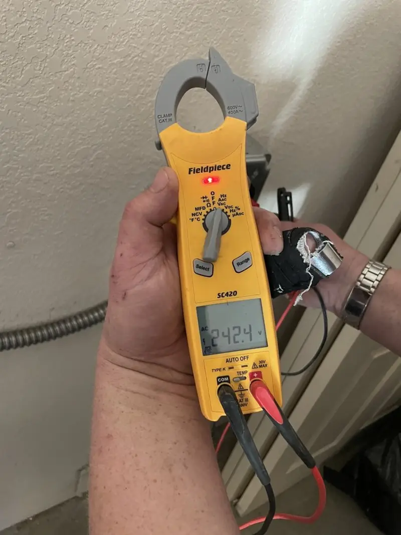 Voltage testing with clamp meter during Ceiling Fan Installation in Middleburg Heights
